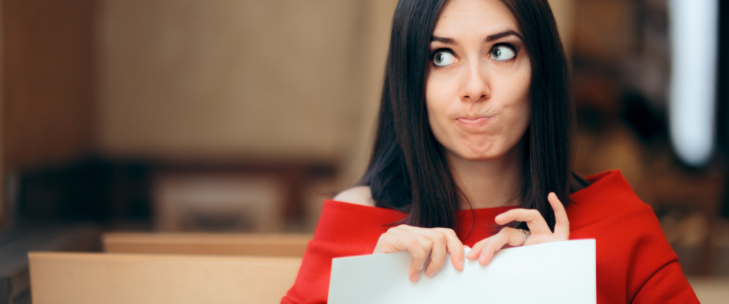 woman tearing up a female autism checklist to show we are more than a checklist